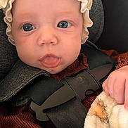 Yazmin joined the competition — help win amazing prizes! baby, infant, face, eyes, bonnet, clothing, car_seat, harness, blanket, hand, soft_texture, portrait, closeup, child, cute, expression, indoors, person, newborn, warm