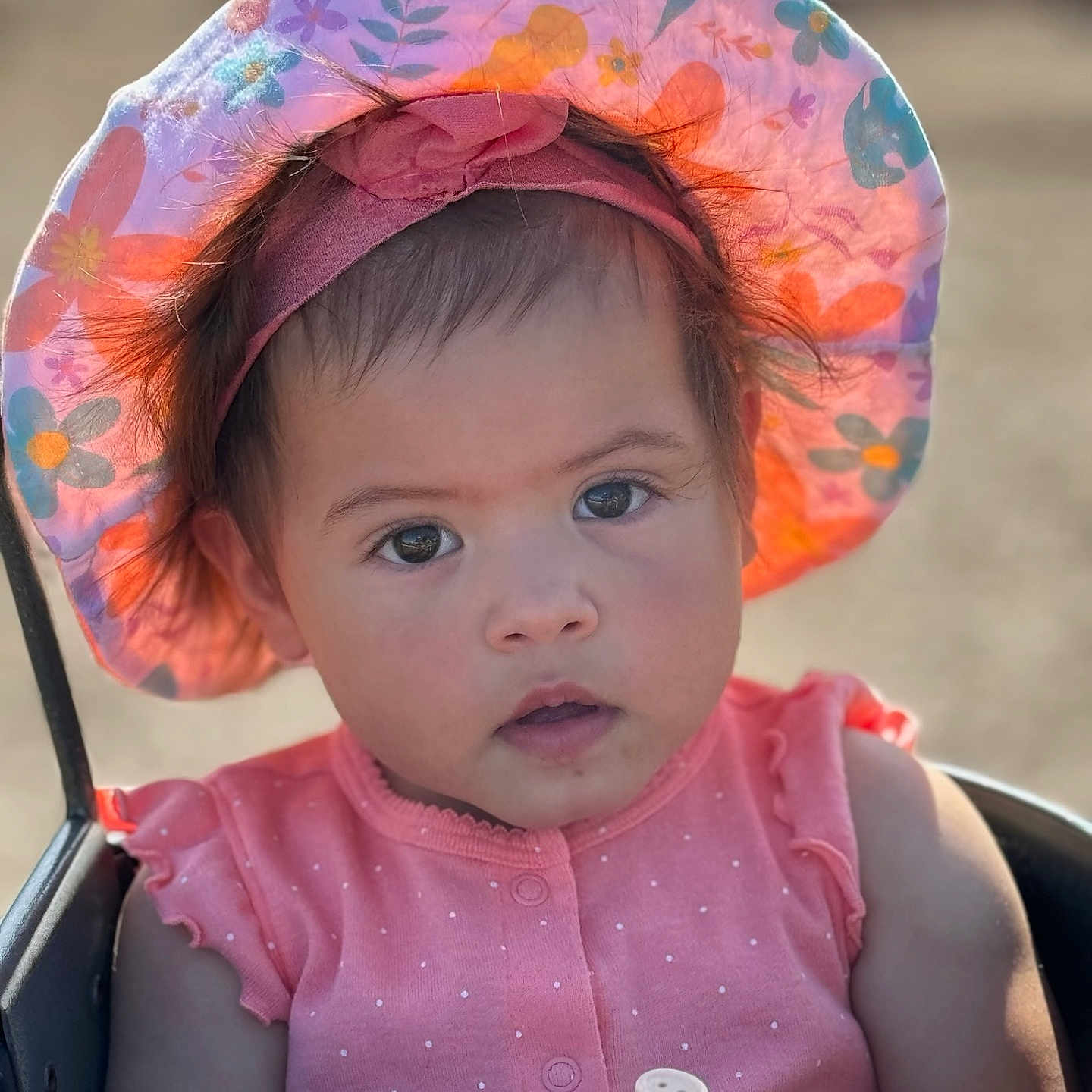 Arya is registered to the contest to win money with this photo: accessories, baby, bonnet, cap, clothing, cowboyhat, dress, face, happy, hat, head, person, photography, portrait, sitting, smile, stroller, summer, sunglasses, sunhat