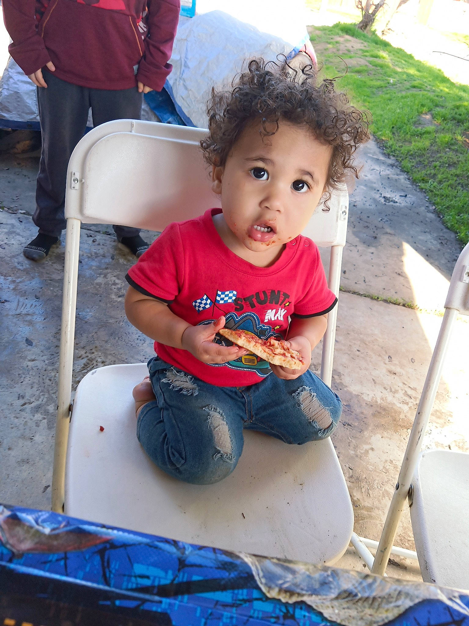 Darius joined the competition — help win amazing prizes! baby_toddler_clothing, blue, chair, child, fun, grass, happy, lap, leg, leisure, outdoor_furniture, people, person, plant, recreation, shoe, shorts, sitting, sneakers, toddler
