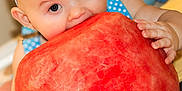 Silas joined the competition — help win amazing prizes! baby, child, watermelon, food, fruit, party_hat, blue, balloon, cute, celebration, happy, indoor, skin, hand, face, eyes, mouth, headband, sitting, bright