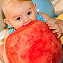 baby, child, watermelon, food, fruit, party_hat, blue, balloon, cute, celebration, happy, indoor, skin, hand, face, eyes, mouth, headband, sitting, bright