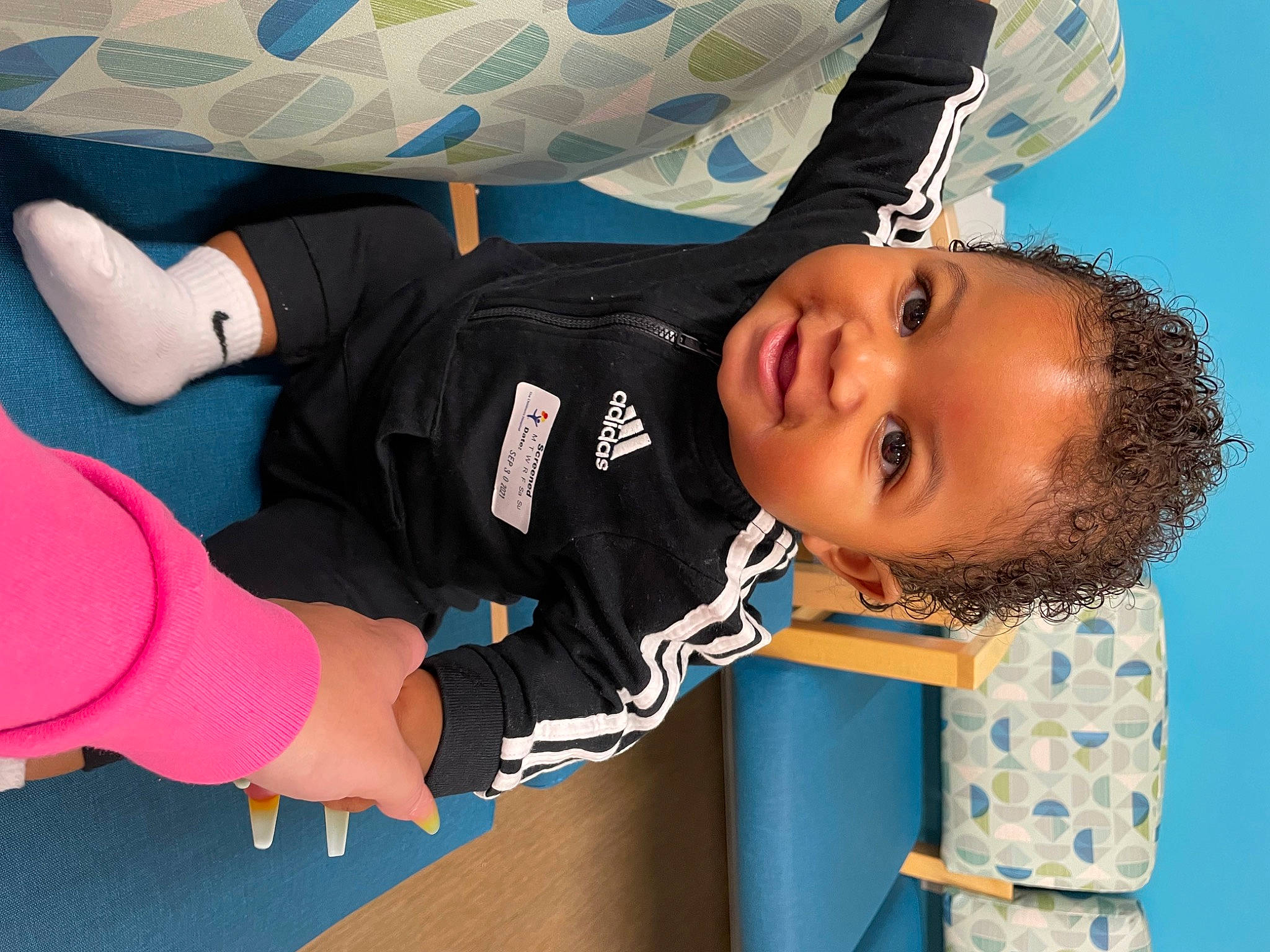 Jayceon is registered to the contest to win money with this photo: arm, baby, baby_products, baby_toddler_clothing, child, comfort, elbow, electric_blue, fun, gesture, happy, joint, knee, leisure, person, sleeve, t_shirt, thumb, toddler, white