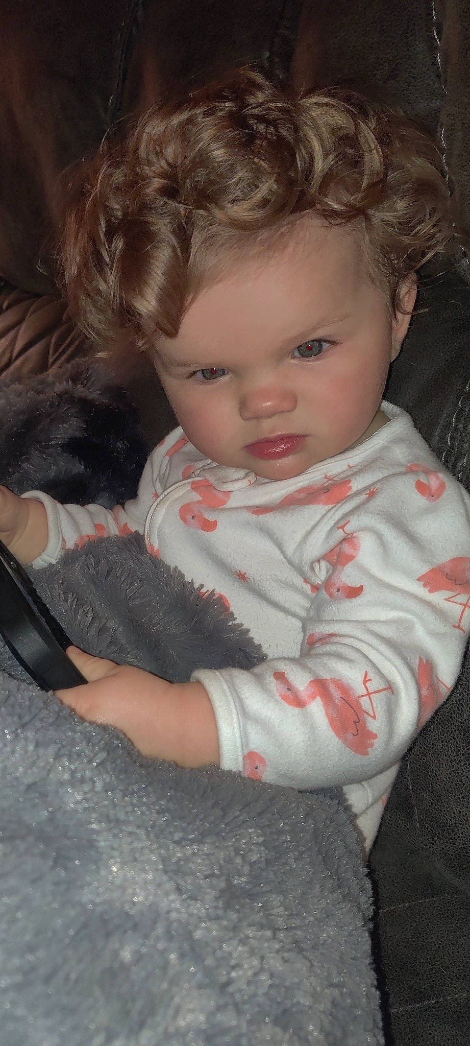 Paizlee is registered to the contest to win money with this photo: baby, baby_toddler_clothing, beauty, cheek, child, comfort, eye, eyelash, finger, flooring, hairstyle, iris, lap, mobile_phone, nose, organ, person, sitting, skin, sleeve