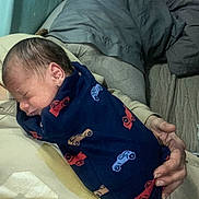 Benjamin joined the competition — help win amazing prizes! newborn, baby, blanket, car_print, sleeping, infant, child, hand, adult, bedroom, indoor, comfort, resting, cozy, parent, tenderness, close_up, human, sleep, family