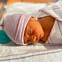 newborn, baby, sleeping, hospital, blanket, cap, crib, infant, face, closeup, headwear, wrapped, comfort, soft_lighting, peaceful, portrait, skin, resting, child, healthcare