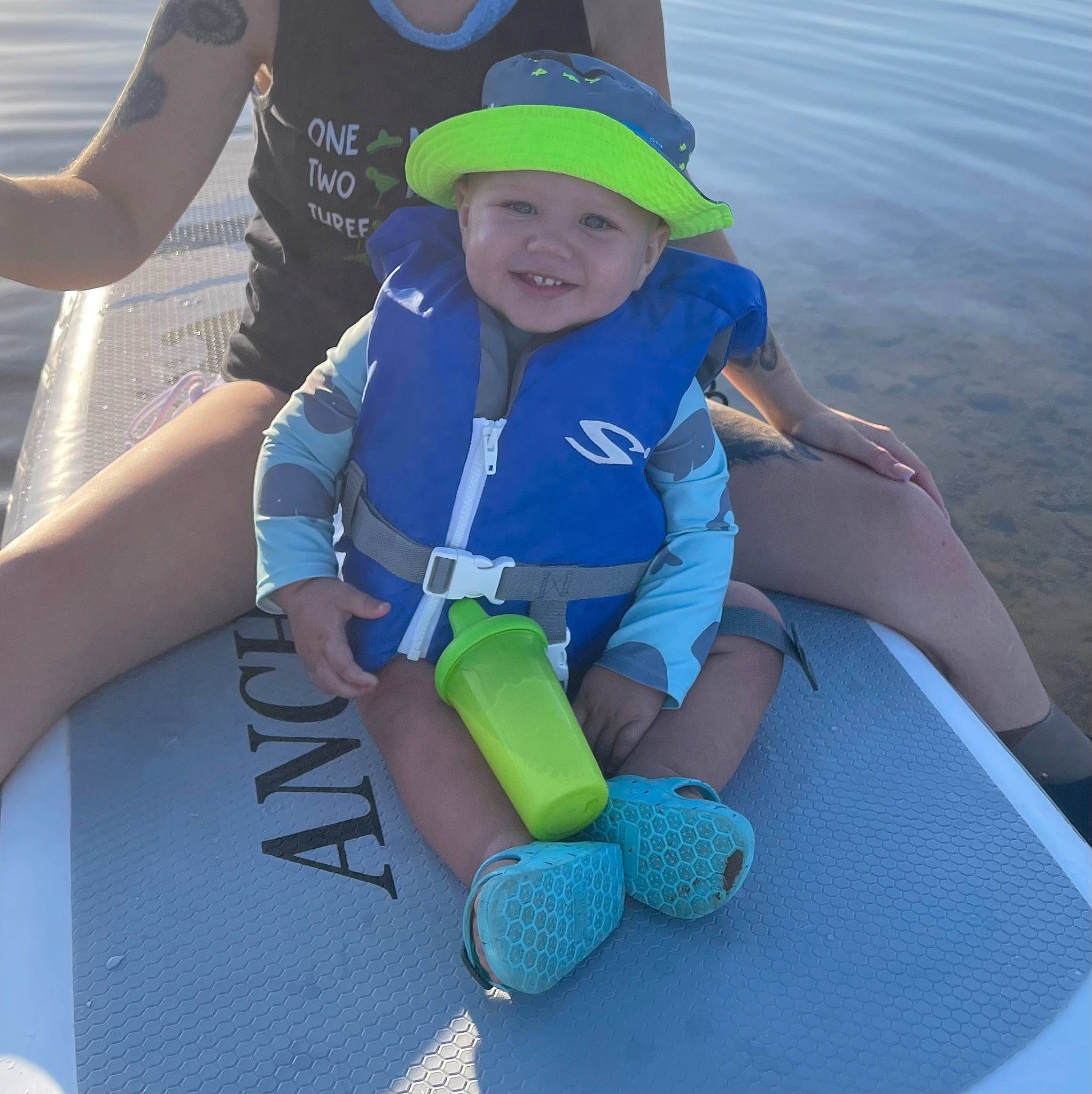 Enzo joined the competition — help win amazing prizes! aqua, azure, baby_toddler_clothing, baseball_cap, boats_and_boating_equipment_and_supplies, cap, child, fun, green, happy, hat, headwear, joy, leisure, lifejacket, person, personal_protective_equipment, recreation, shorts, smile