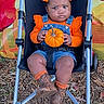 Nova is registered to the contest to win money with this photo: baby, child, stroller, pumpkin, autumn, fall, orange, bows, overalls, cowboy_boots, boots, portrait, sitting, outdoor, colorful, seasonal, fashion, infant, smiling, photography