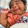 Zyair joined the competition — help win amazing prizes! baby, sleeping, smile, curly_hair, orange_shirt, blanket, cozy, cute, infant, closeup, face, child, soft_texture, happy, relaxed, portrait, indoors, young_child, apparel, toddler
