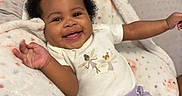 Anova joined the competition — help win amazing prizes! baby, smiling, infant, blanket, purple_pants, white_shirt, fairy_print, happy, cute, child, indoor, cozy, soft_texture, patterned_blanket, relaxed, portrait, person, arms_outstretched, curly_hair, comfortable