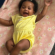 Anova joined the competition — help win amazing prizes! baby, child, infant, yellow_outfit, pink_blanket, curly_hair, white_bow, smiling, happy, soft_texture, lying_down, cute, adorable, playful, indoors, cozy, socks, small_arms, cheerful, portrait