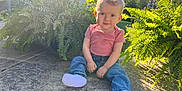 Riverlyn is registered to the contest to win money with this photo: toddler, child, outdoor, sunlight, greenery, fern, jeans, pink_shirt, socks, concrete, curious, grass, nature, portrait, baby, young_child, sunny_day, casual_clothing, smile, sitting