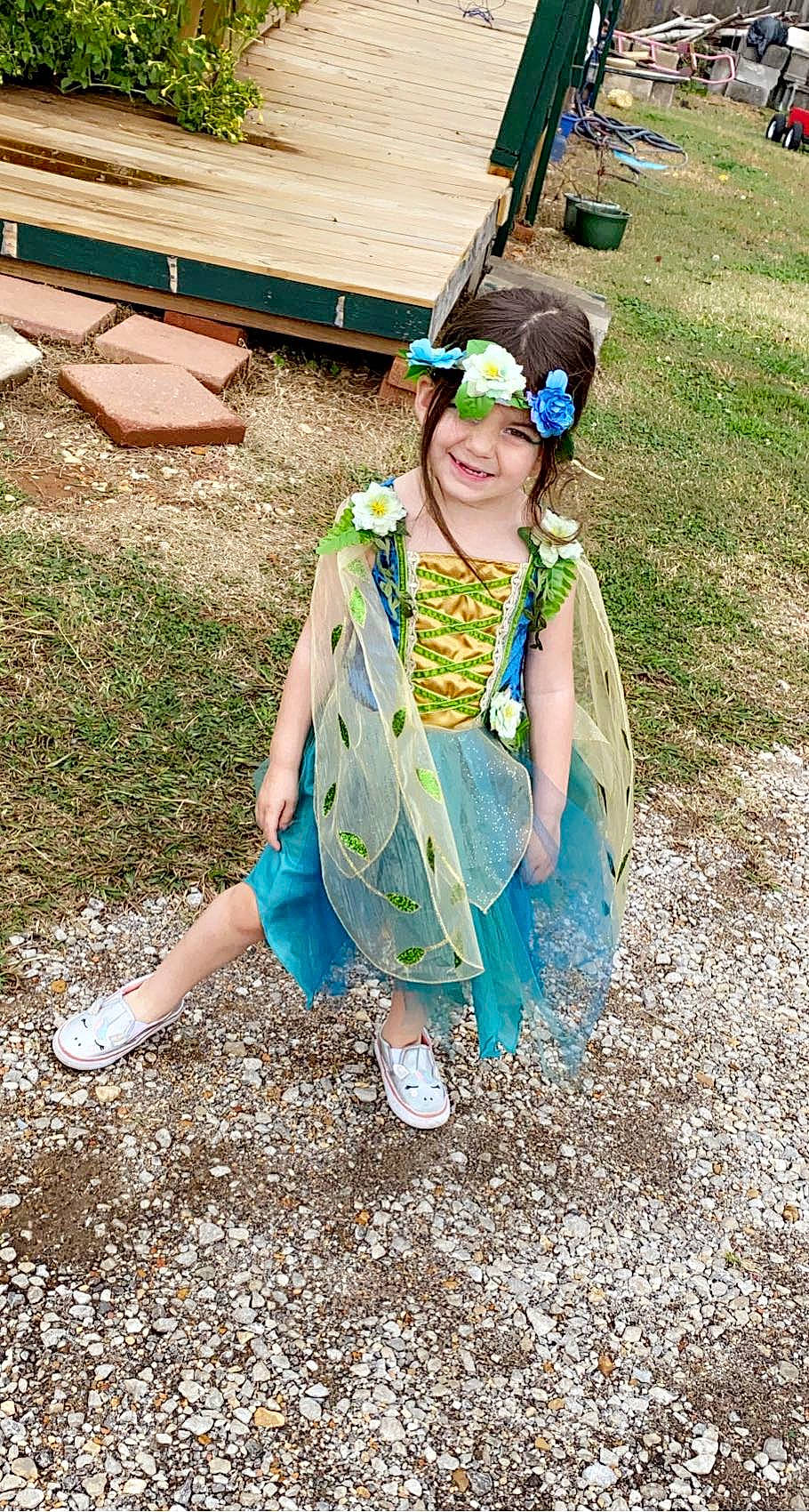 Sophie Mae is registered to the contest to win money with this photo: bench, child, costume, electric_blue, eyewear, fashion_accessory, fun, garden, goggles, grass, happy, headwear, joy, leisure, people_in_nature, person, personal_protective_equipment, play, recreation, sitting