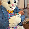 baby, newborn, easter_bunny, mascot, costume, person, child, indoor, bench, flowers, floral, wood, table, cute, sleeping, holding, white, blue, yellow, pink