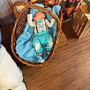 Braxton joined the competition — help win amazing prizes! baby, basket, blanket, blue_clothing, bow_tie, wooden_floor, flower_pots, flowers, indoor, sleeping, cute, infant, easter, toddler, cozy, wicker, soft_texture, peaceful, decor, footwear
