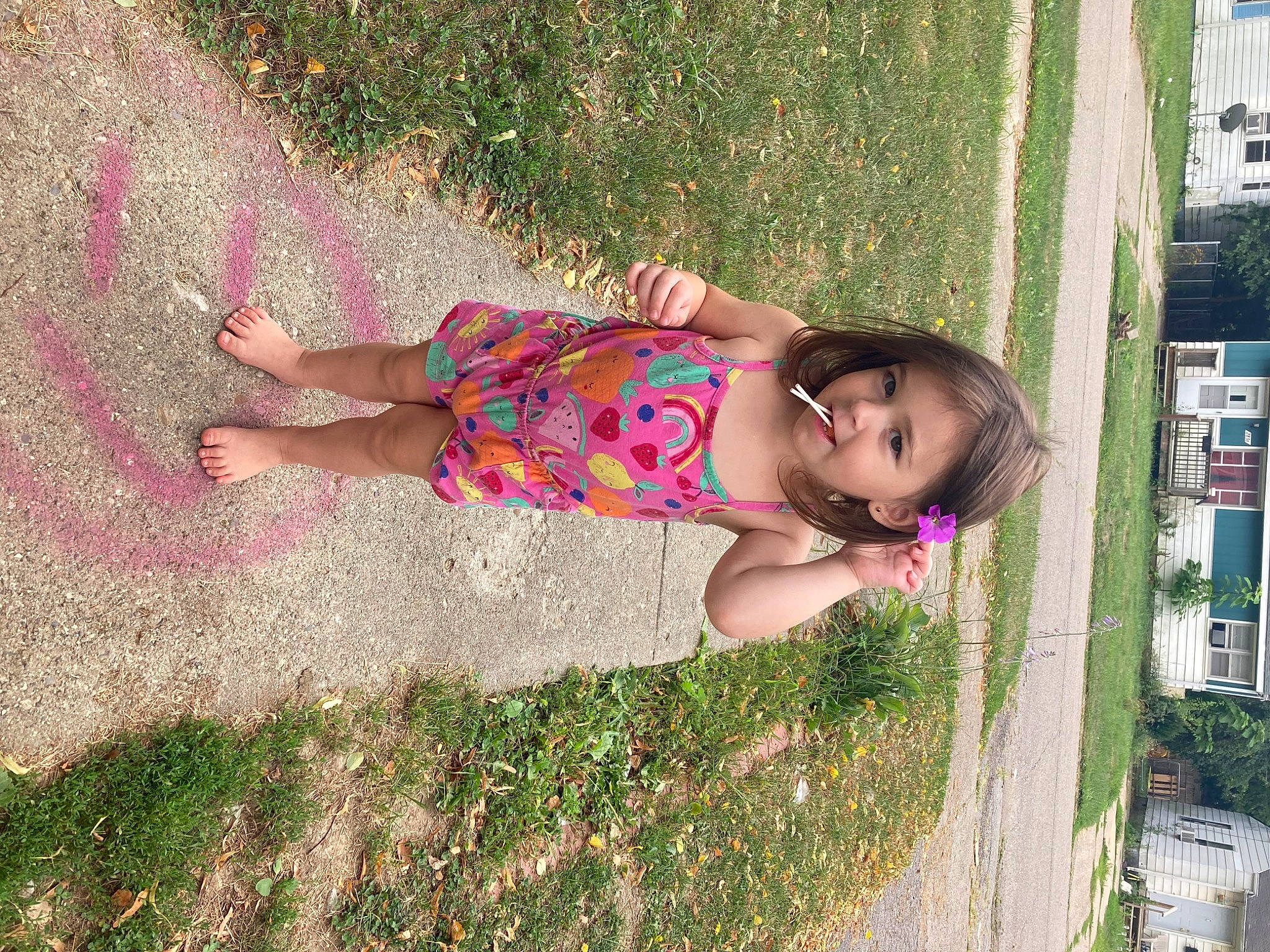 Adahlia is registered to the contest to win money with this photo: baby_toddler_clothing, child, city, foot, fun, grass, happy, human_leg, leisure, magenta, pattern, people_in_nature, person, pink, plant, public_space, sidewalk, thigh, tints_and_shades, toddler