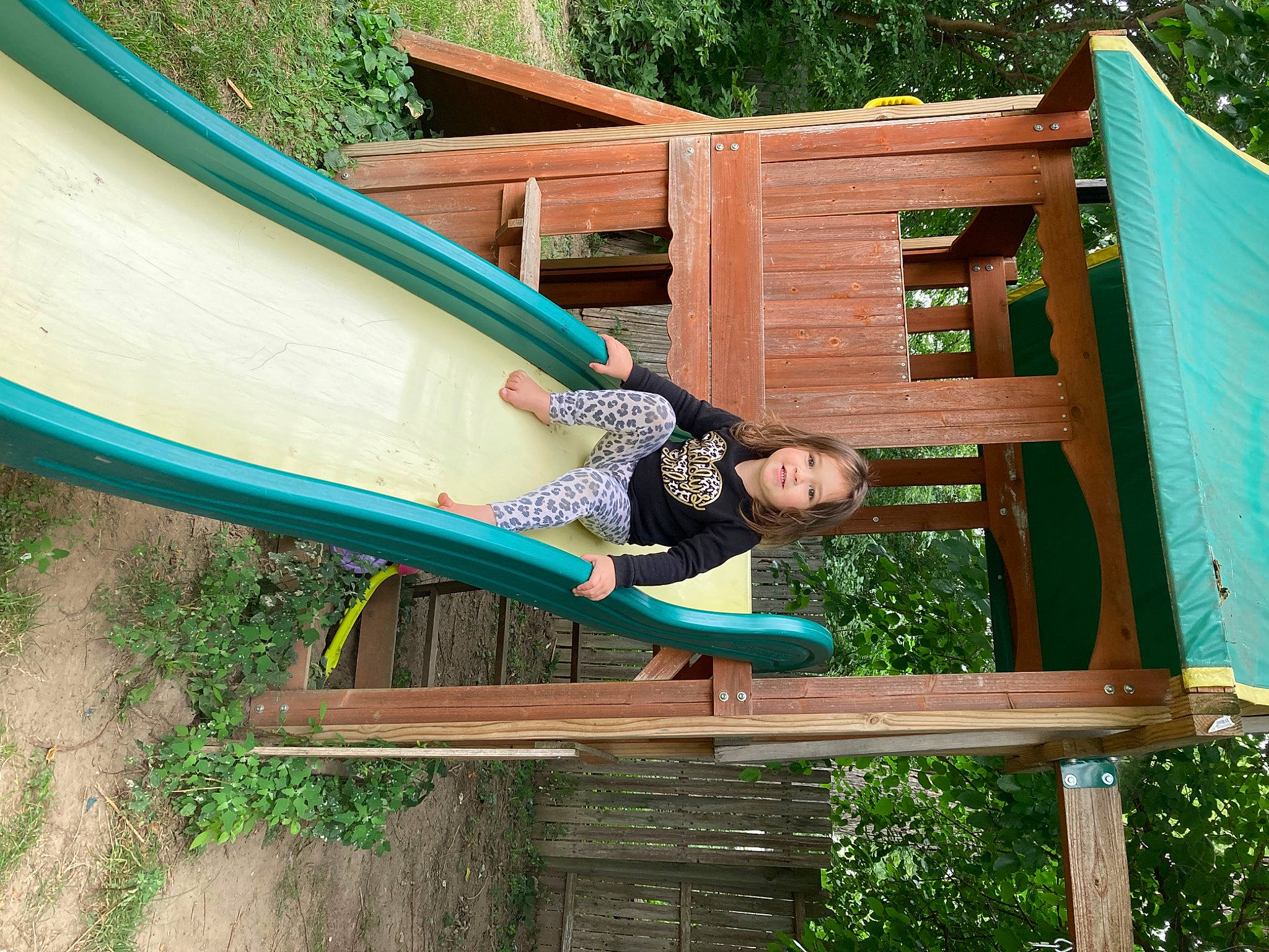 Adahlia joined the competition — help win amazing prizes! boats_and_boating_equipment_and_supplies, botany, chute, fun, grass, green, joy, leisure, outdoor_play_equipment, outdoor_recreation, people_in_nature, person, plant, playground, public_space, recreation, shade, shorts, smile, tree