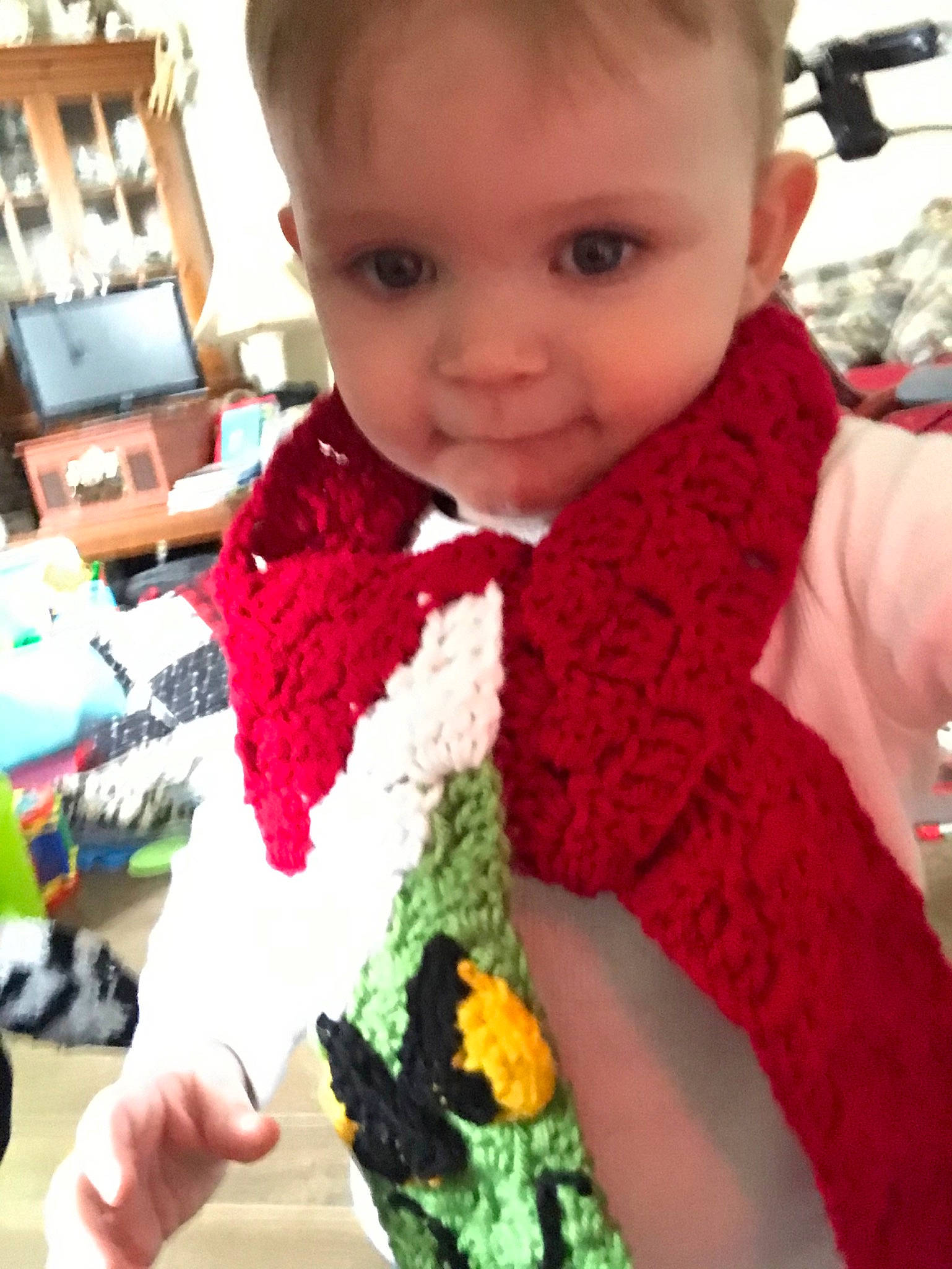 Scott-anthony is registered to the contest to win money with this photo: art, child, craft, crochet, fashion_accessory, knitting, neck, outerwear, person, scarf, textile, thread, toddler, wool, woolen