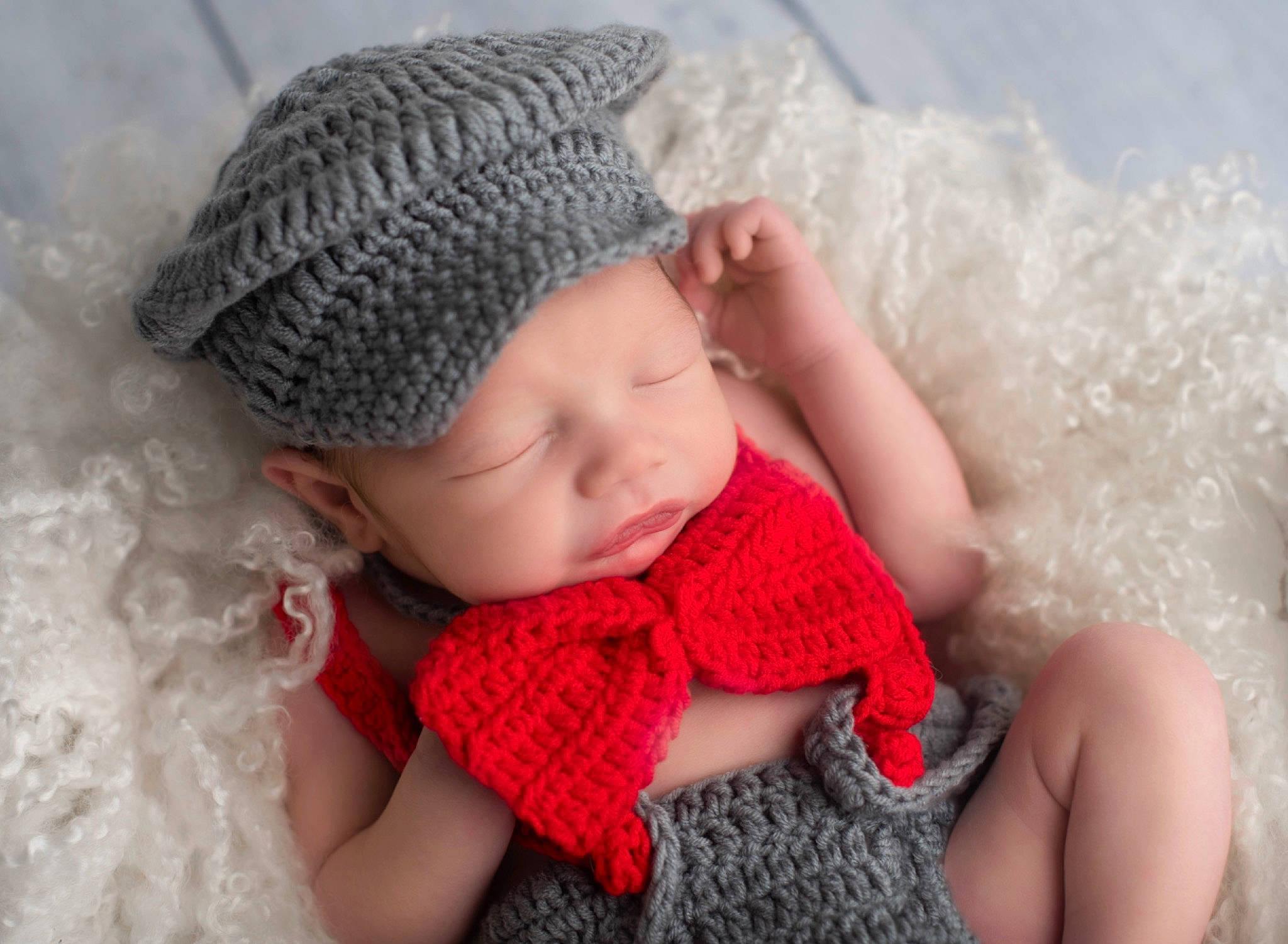 Arlo is registered to the contest to win money with this photo: baby, baby_toddler_clothing, cap, clothing, comfort, dress, eye, eyelash, finger, hair, hand, happy, head, headgear, headwear, lip, person, pink, skin, textile