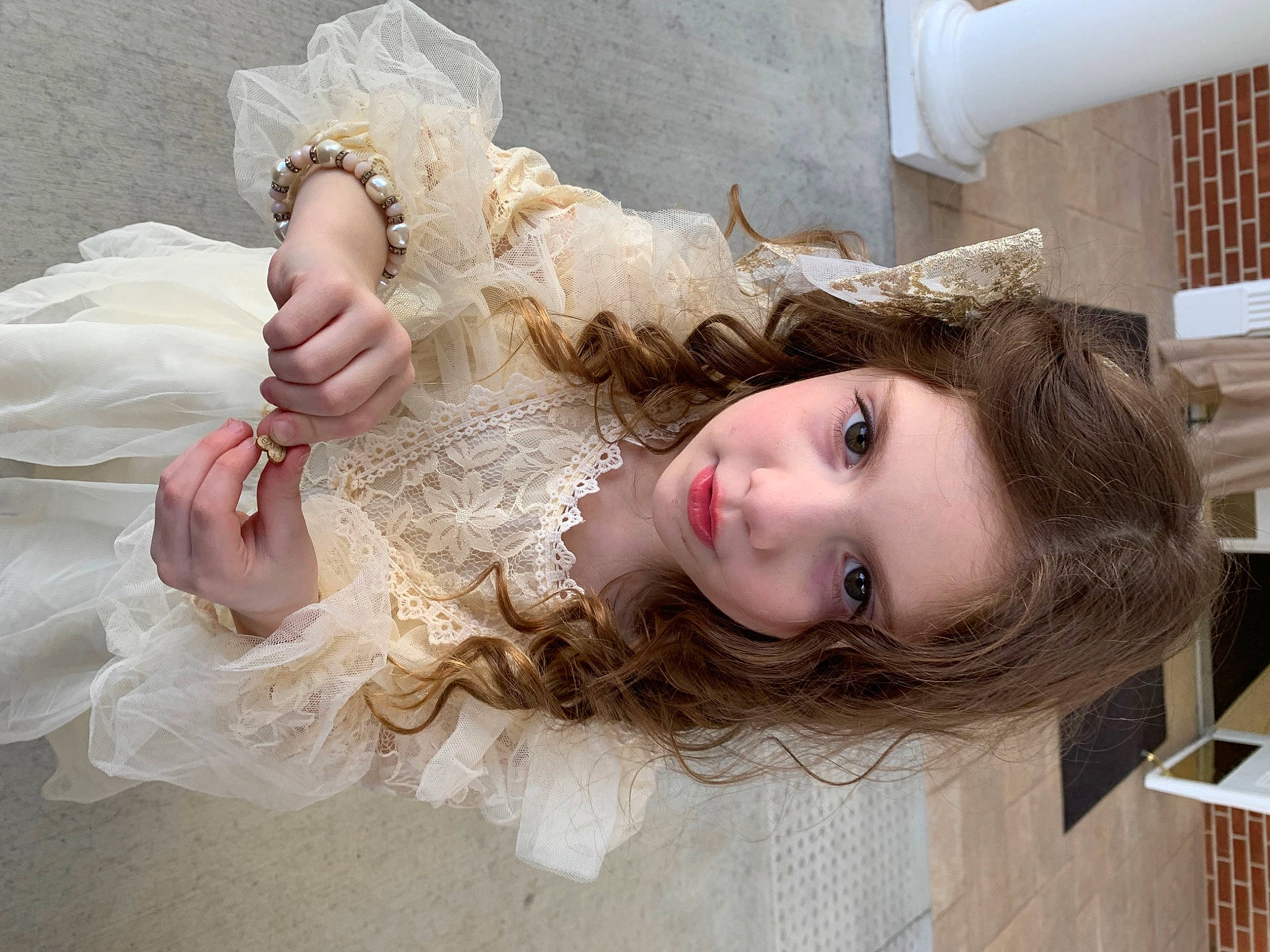 Delilah joined the competition — help win amazing prizes! bridal_accessory, bridal_clothing, child, dress, embellishment, event, eyelash, fashion_accessory, fashion_design, gesture, gown, hair_accessory, happy, headpiece, jewellery, person, skin, toddler, wedding_ceremony_supply, wedding_dress