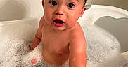 Azriel joined the competition — help win amazing prizes! baby, child, infant, bath, bathtub, bubble_bath, foam, water, wet, hair, soap, bath_toy, colorful_toys, portrait, sitting, indoors, bathroom, smiling, surprised, close_up