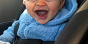 Noah joined the competition — help win amazing prizes! baby, child, smiling, car_seat, blue_jacket, fleece, happy, indoors, seatbelt, infant, cute, person, safety, car_interior, window, sunlight, portrait, clothing, young_child, human