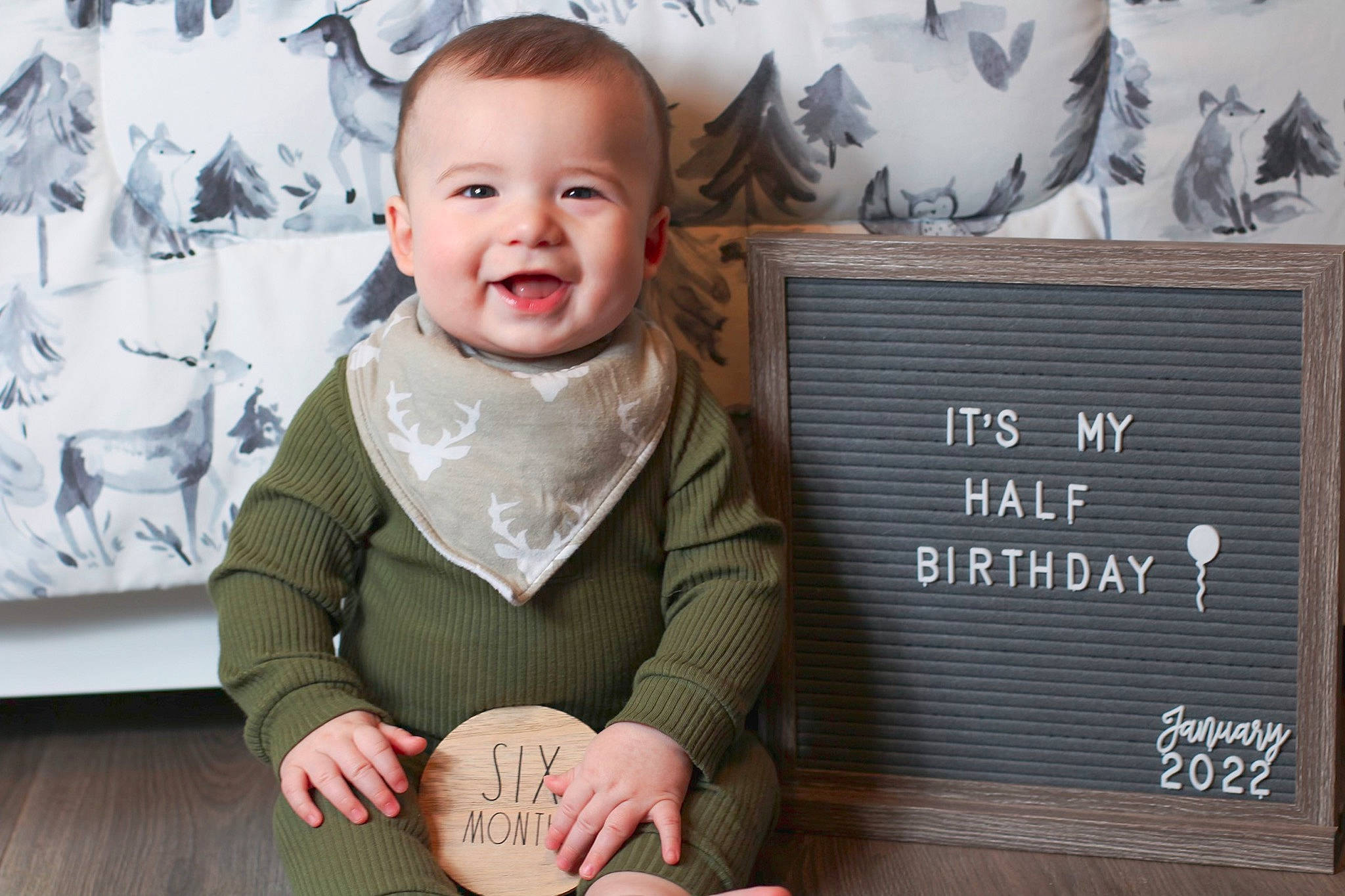 Nash is registered to the contest to win money with this photo: baby, baby_laughing, baby_toddler_clothing, cheek, child, eye, happy, head, joy, organ, person, photo_caption, product, room, sitting, sleeve, smile, toddler, tree, vertebrate