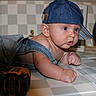 baby, denim, cap, overalls, drool, tools, wrench, drill, measuring_tape, checkered_floor, curious, infant, face, hand, floor, indoor, person, child, blue, hat