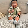 Koda joined the competition — help win amazing prizes! baby, blanket, child, chubby_cheeks, couch, cushion, cute, happy, infant, living_room, outfit, portrait, shorts, sitting, smiling, socks, sofa, striped_shirt, tiny_feet, window