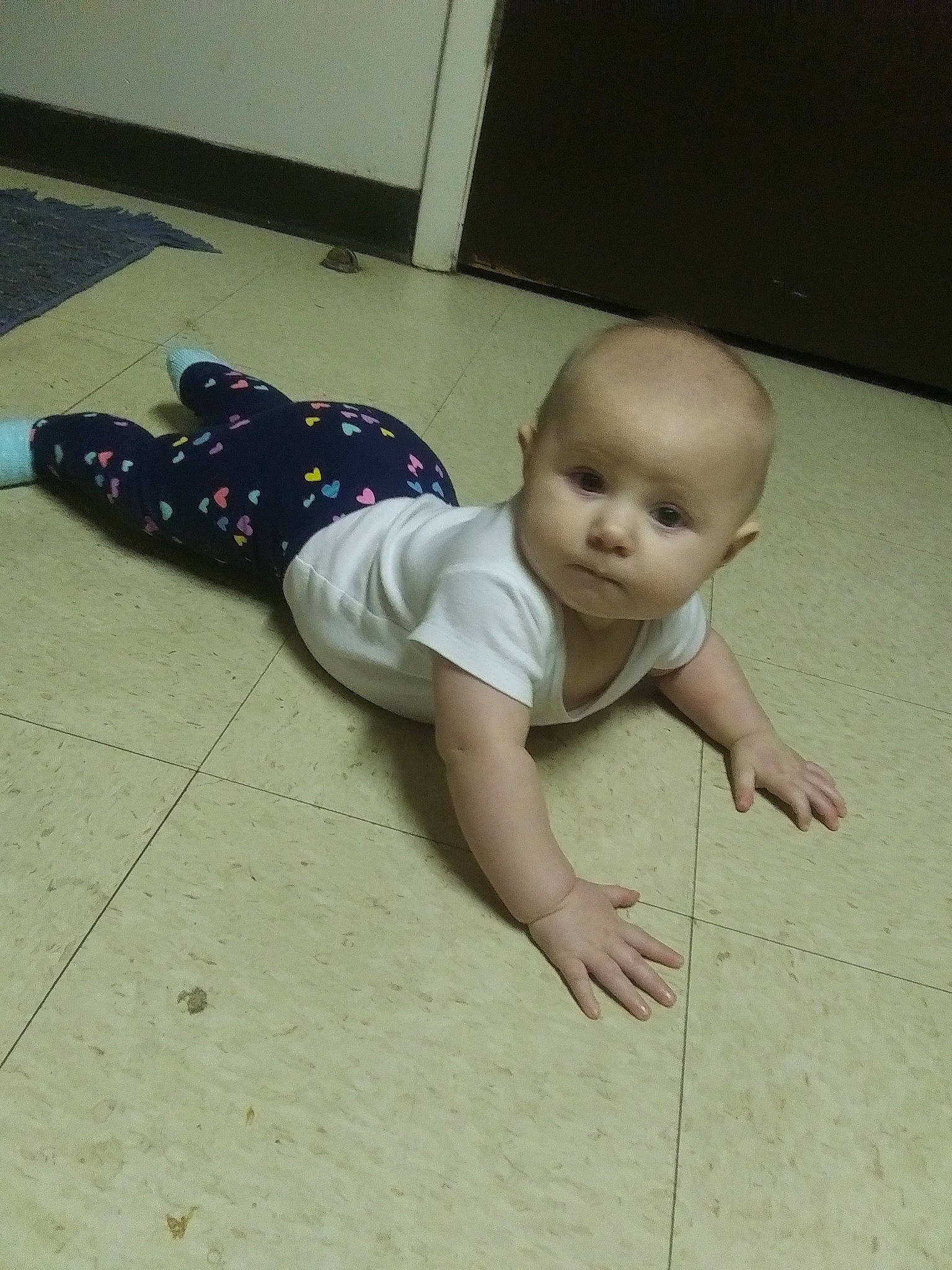 Delylah is registered to the contest to win money with this photo: baby, child, crawling, floor, flooring, leg, person, skin, toddler, tummy_time