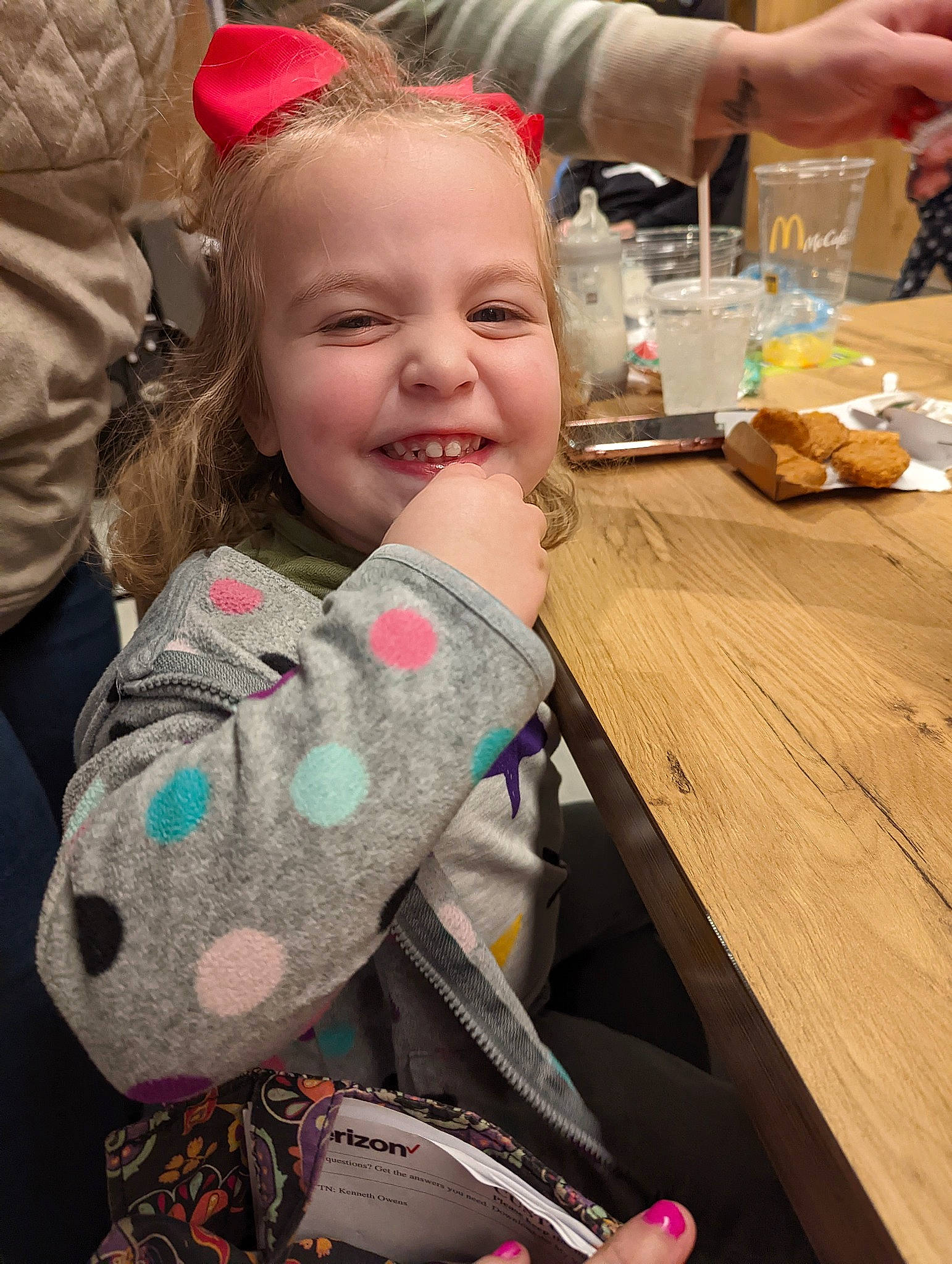 Evie is registered to the contest to win money with this photo: baby, blond, chair, child, event, fashion_accessory, fun, happy, holiday, joy, pattern, person, pink, plate, sitting, skin, sleeve, smile, table, tableware