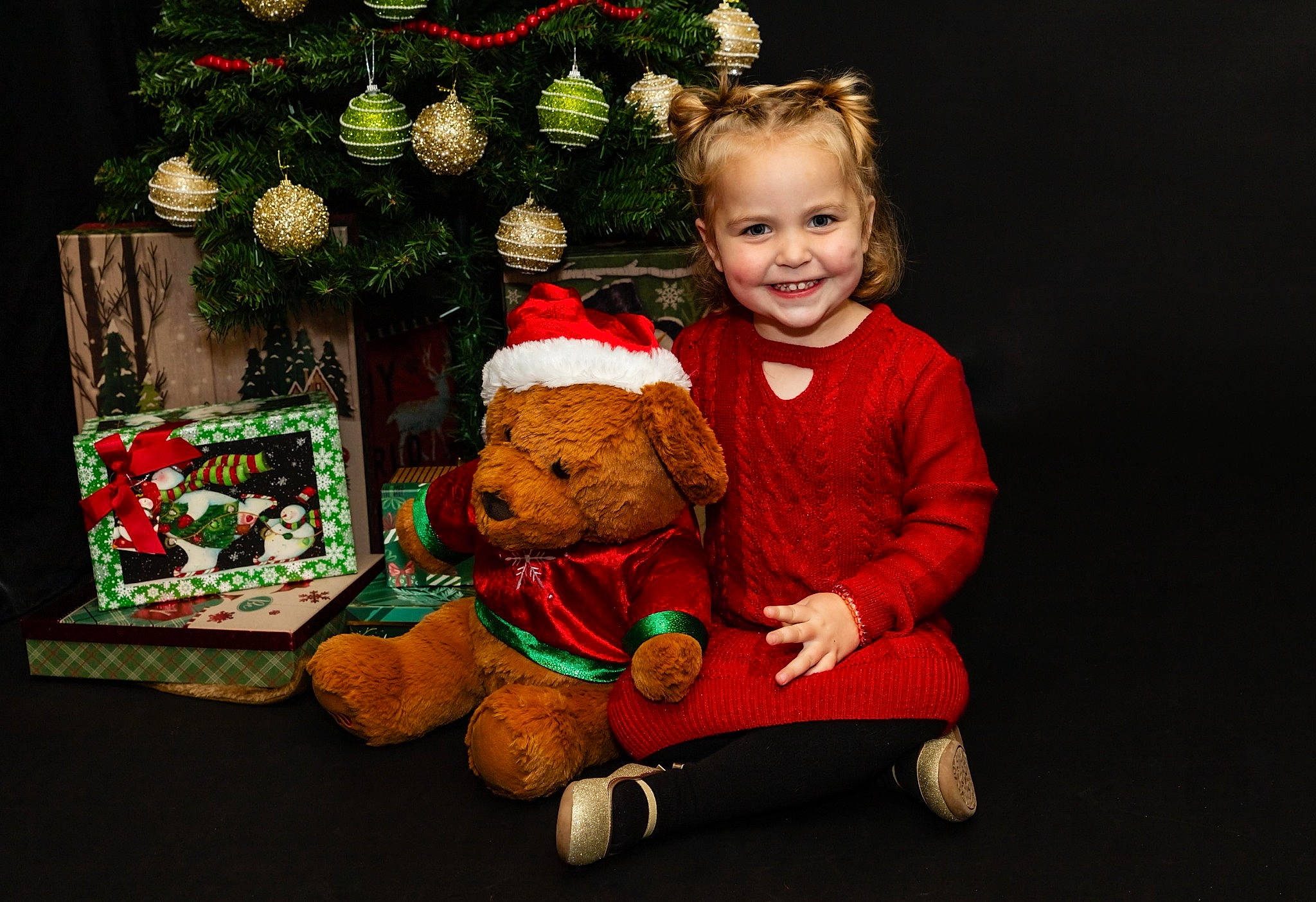 Evie joined the competition — help win amazing prizes! christmas, christmas_decoration, christmas_eve, christmas_ornament, christmas_tree, event, happy, holiday, holiday_ornament, joy, lap, ornament, person, plush, red, room, smile, stuffed_toy, teddy_bear, toddler