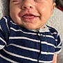 Briggs is registered to the contest to win money with this photo: baby, smiling, face, infant, striped_clothing, onesie, happy, tongue_out, close_up, child, skin, cute, sleepy, newborn, person, cheeks, human, portrait, baby_clothes, resting