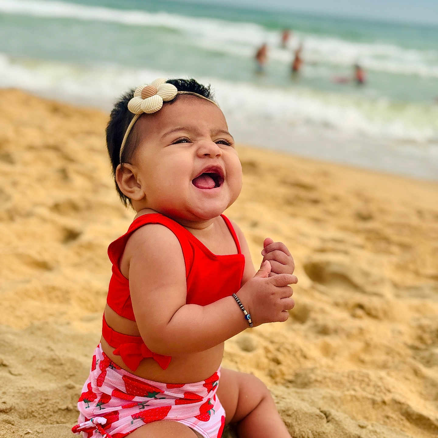 Prayah joined the competition — help win amazing prizes! baby, beach, child, cute, happy, headband, nature, ocean, outdoor, playful, red_clothing, sand, sitting, smiling, summer, sunny, toddler, vacation, water, waves