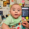 Caden joined the competition — help win amazing prizes! baby, infant, walker, hand, adult, person, indoor, computer, screen, notes, wall, photo, colorful, toy, clothing, face, expression, skin, holding, office