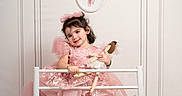 Lia joined the competition — help win amazing prizes! child, girl, ballet, tutu, pink_dress, ballet_barre, doll, smiling, indoor, flooring, headband, posing, happy, young_child, portrait, footwear, dance, decor, white_wall, floor