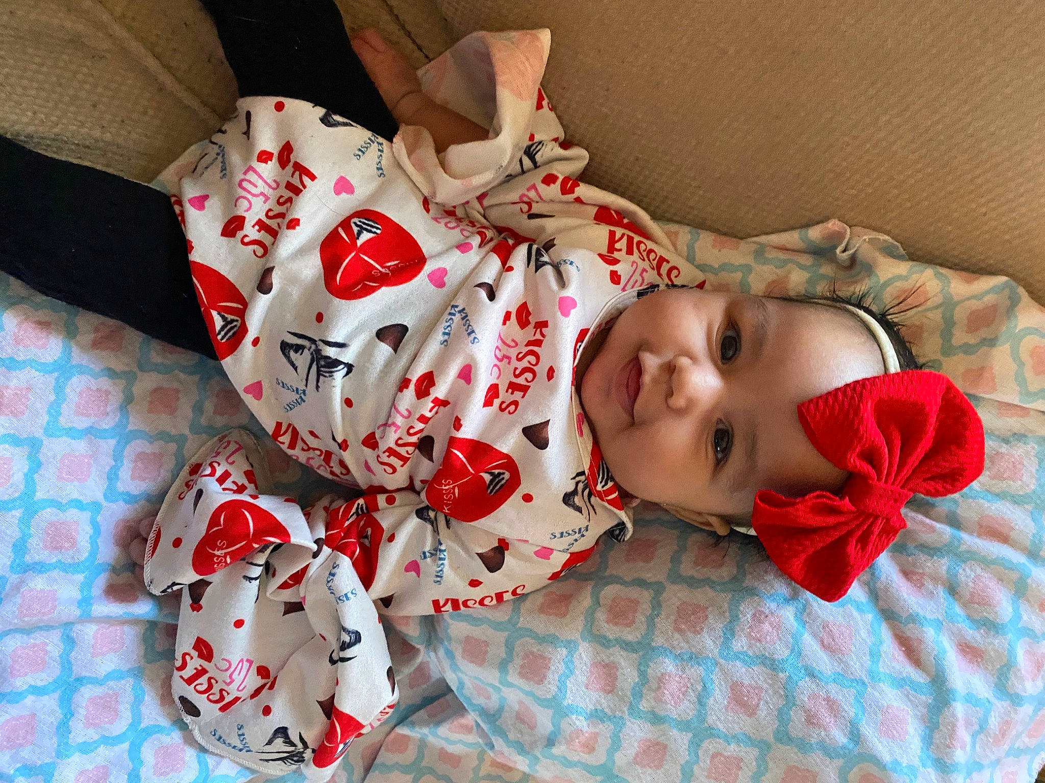 Kamille is registered to the contest to win money with this photo: baby_toddler_clothing, carmine, child, christmas, comfort, costume, dress, flesh, happy, hat, headwear, linens, pattern, person, plaid, room, sleeve, textile, toddler