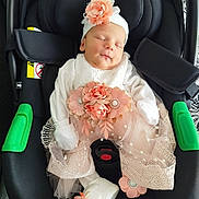 Melissa participe au concours pour gagner de l'argent avec cette photo : baby, newborn, infant, car_seat, flower, headband, white_clothing, booties, sleeping, cute, adorable, peaceful, infant_clothing, baby_girl, seat_belt, fabric, lace, tulle, indoor, soft_lighting