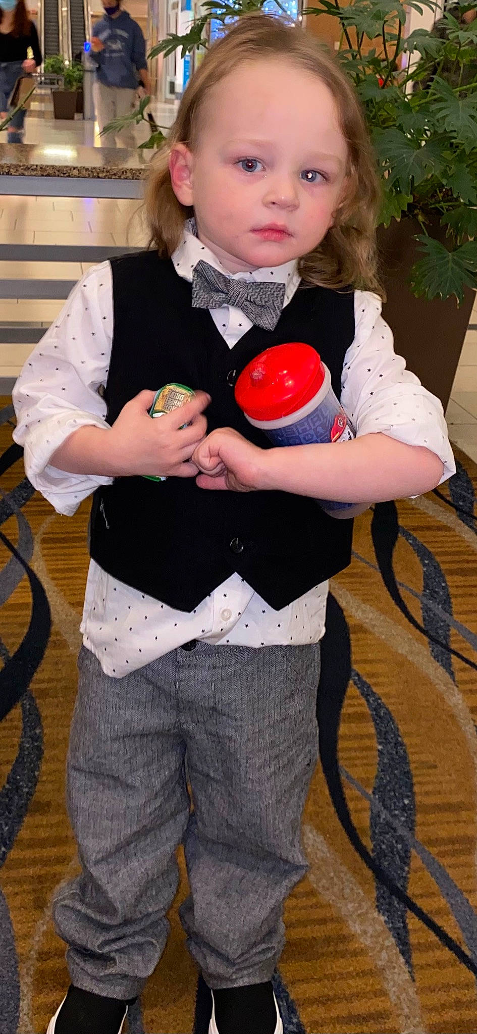 Jd is registered to the contest to win money with this photo: baby, belt, blurred, carmine, child, costume, event, face, flowerpot, fruit, fun, happy, head, houseplant, person, pink, play, sitting, t_shirt, toddler