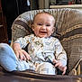 Everett is registered to the contest to win money with this photo: baby, blue_eyes, child, comfort, cute, dinosaur_pajamas, feeding_chair, furniture, happy, high_chair, home, indoor, infant, kitchen, light_brown_hair, messy_face, person, playful, seat_belt, smiling
