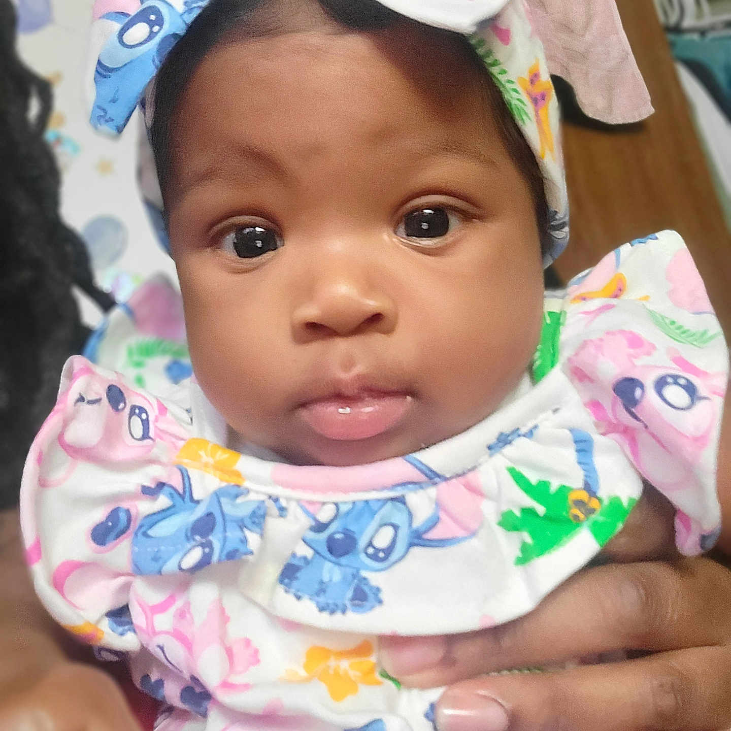 Aleìjah is registered to the contest to win money with this photo: accessories, baby, bonnet, cap, clothing, coat, dress, earring, face, happy, hat, head, jewelry, newborn, person, photography, portrait, selfie, sitting, smile