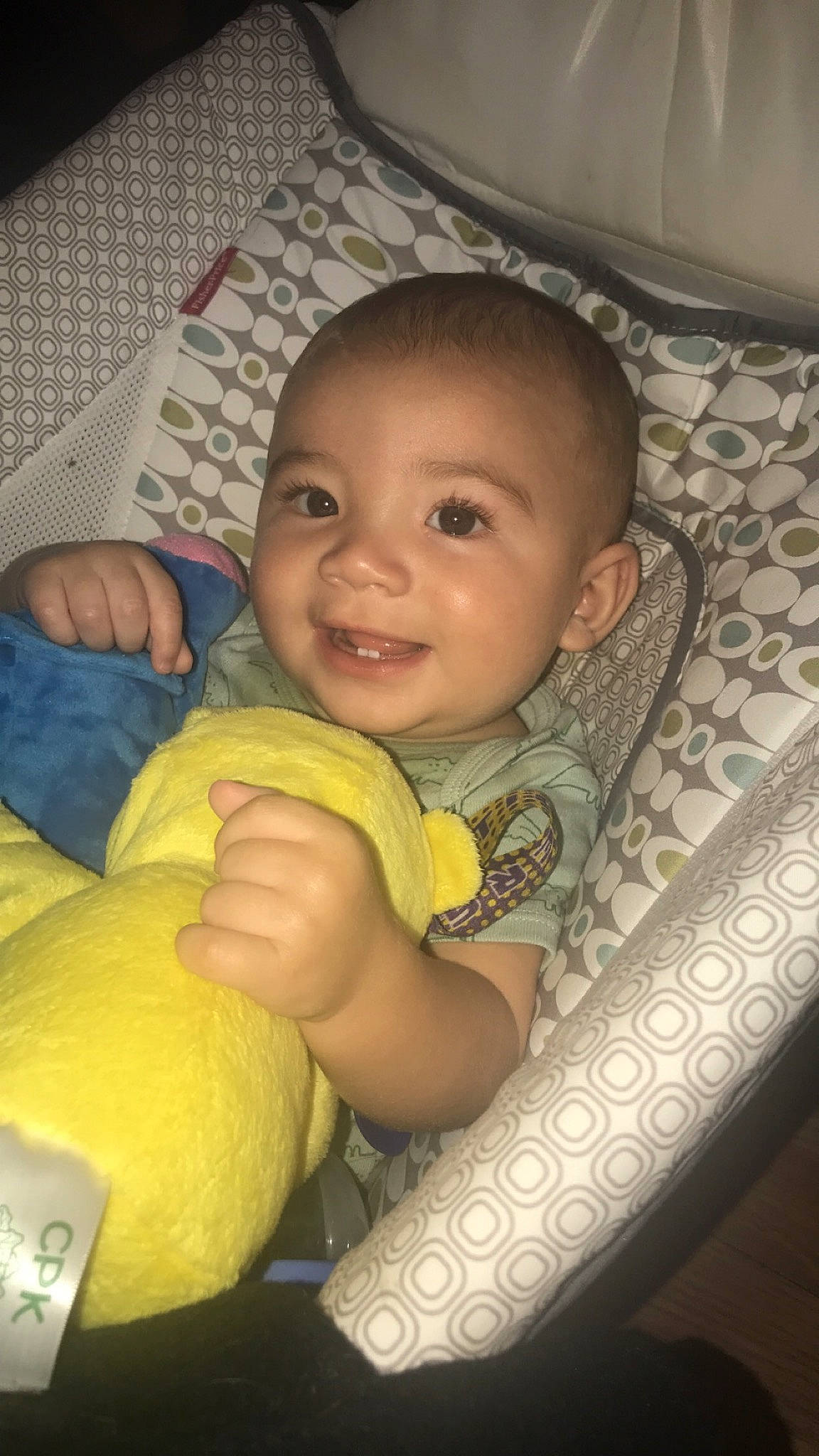 Chad is registered to the contest to win money with this photo: baby, baby_toddler_clothing, black, cheek, comfort, computer_keyboard, eyebrow, finger, happy, human, iris, joy, mouth, nose, organ, peripheral, person, skin, smile, standing