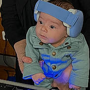 Aydèn participe au concours pour gagner de l'argent avec cette photo : adult, baby, black_jacket, blue_light, child, clothing, curious, dj_mixer, earmuffs, electronic, exploration, glowing_buttons, hand, headgear, indoor, light, mint_green_outfit, music_equipment, person, technology