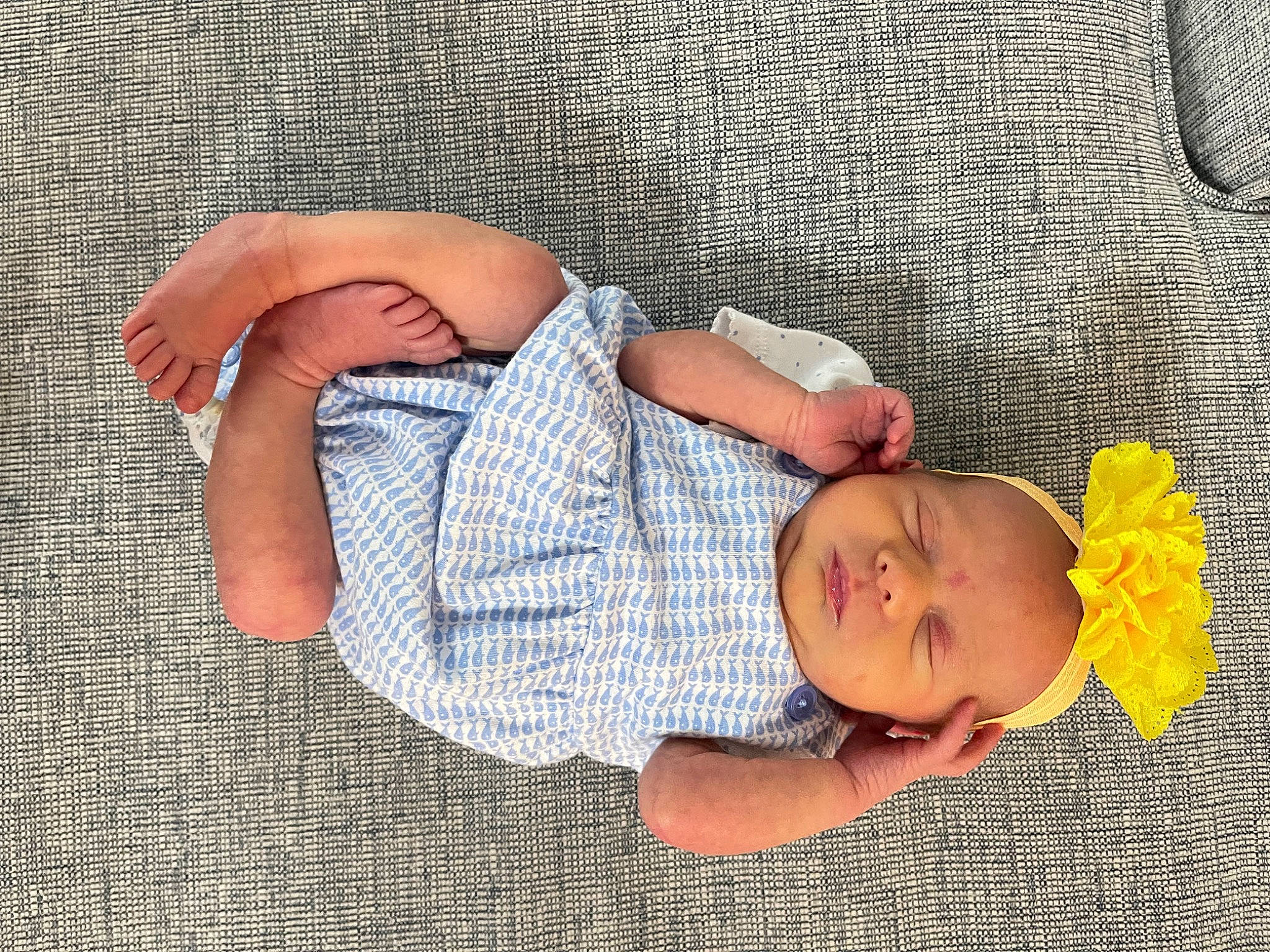 Eden joined the competition — help win amazing prizes! baby, baby_sleeping, baby_toddler_clothing, child, comfort, couch, finger, foot, hand, human_leg, knee, leg, linens, pattern, person, sitting, skin, textile, thigh, toddler