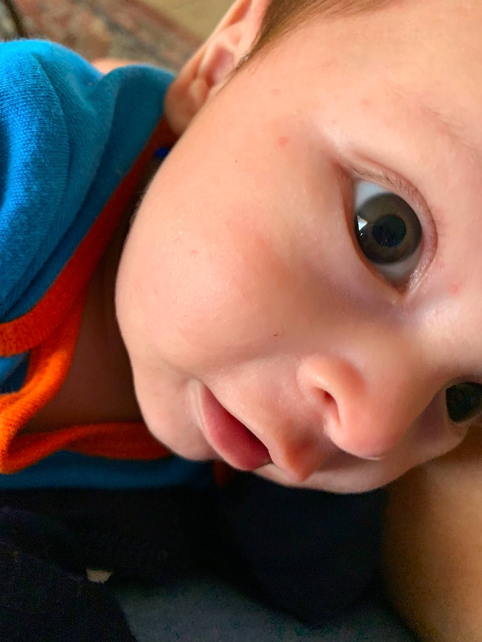 Aron is registered to the contest to win money with this photo: cheek, child, chin, close_up, ear, eye, eyebrow, face, finger, forehead, hand, head, infant, lip, mouth, neck, nose, person, skin, smile