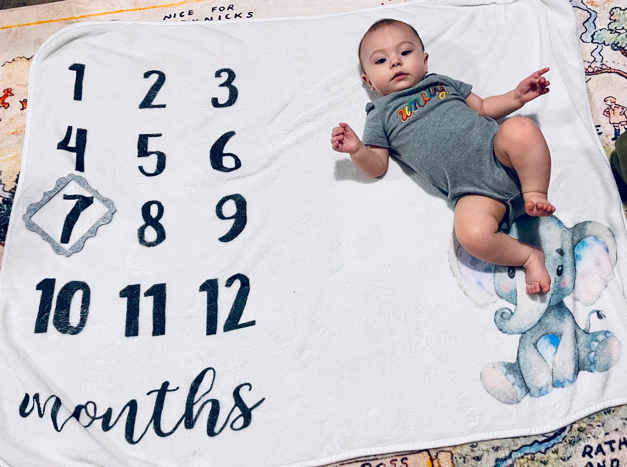 Tessa joined the competition — help win amazing prizes! advertising, art, baby, baby_toddler_clothing, child, comfort, event, facial_expression, font, happy, linens, pattern, person, photograph, photography, rectangle, room, sleeve, t_shirt, textile