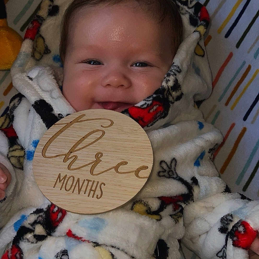 Asher is registered to the contest to win money with this photo: baby, bed, blanket, bonnet, clothing, crib, cutlery, face, furniture, glove, hat, head, homedecor, infantbed, newborn, person, photography, portrait, quilt, spoon