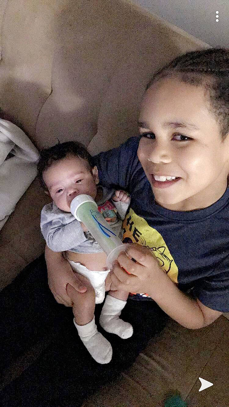 Elisha is registered to the contest to win money with this photo: baby, child, fun, joy, leg, mouth, nose, people, person, sibling, sitting, skin, smile, snapshot, toddler