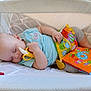 baby, bed, beverage, coffee, couch, cradle, crib, cushion, cutlery, face, furniture, head, homedecor, infantbed, newborn, person, pillow, scissors, sleeping, spoon