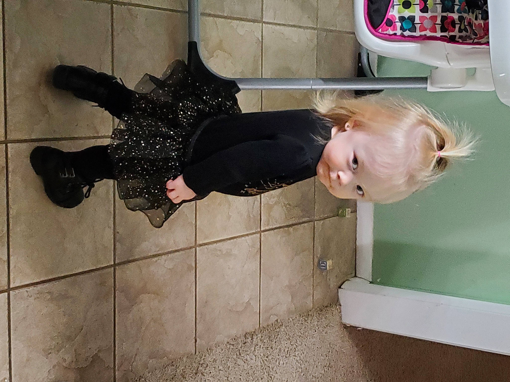Kaylie is registered to the contest to win money with this photo: baby, baby_toddler_clothing, child, door, dress, flooring, fun, happy, pattern, person, room, smile, t_shirt, toddler, vehicle_door, window