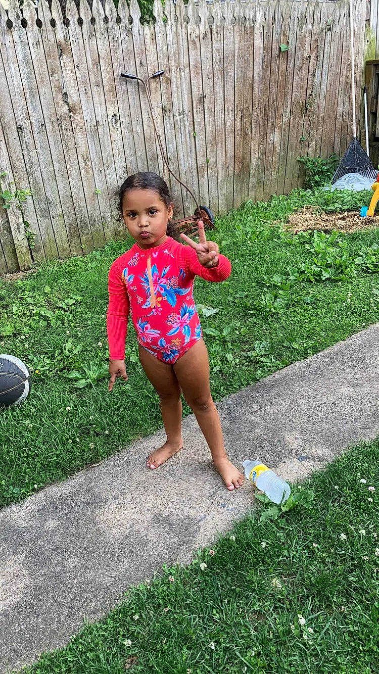 Kehlani is registered to the contest to win money with this photo: baby_toddler_clothing, ball, barefoot, child, foot, fun, grass, happy, human_leg, lawn, leg, leisure, people_in_nature, person, plant, recreation, spring, thigh, toddler, waist